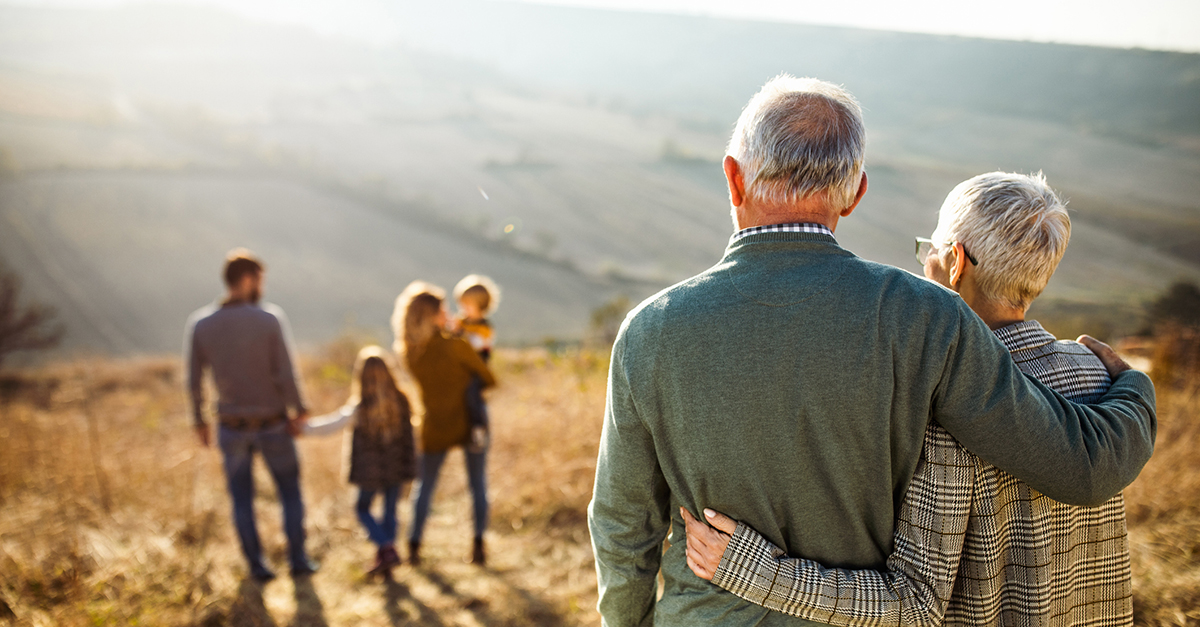 A multigenerational family enjoys a hike